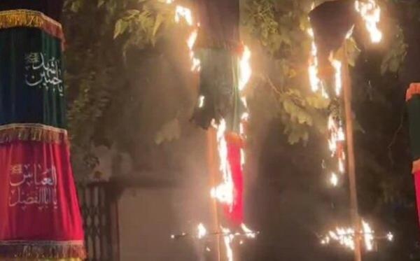 تصاویر و جزئیات حمله چند ناشناس به علم عزای سیدالشهدا(ع) در اصفهان ، واکنش مردم به لحظه آتش زدن علم و کتل سیدالشهدا(ع)
